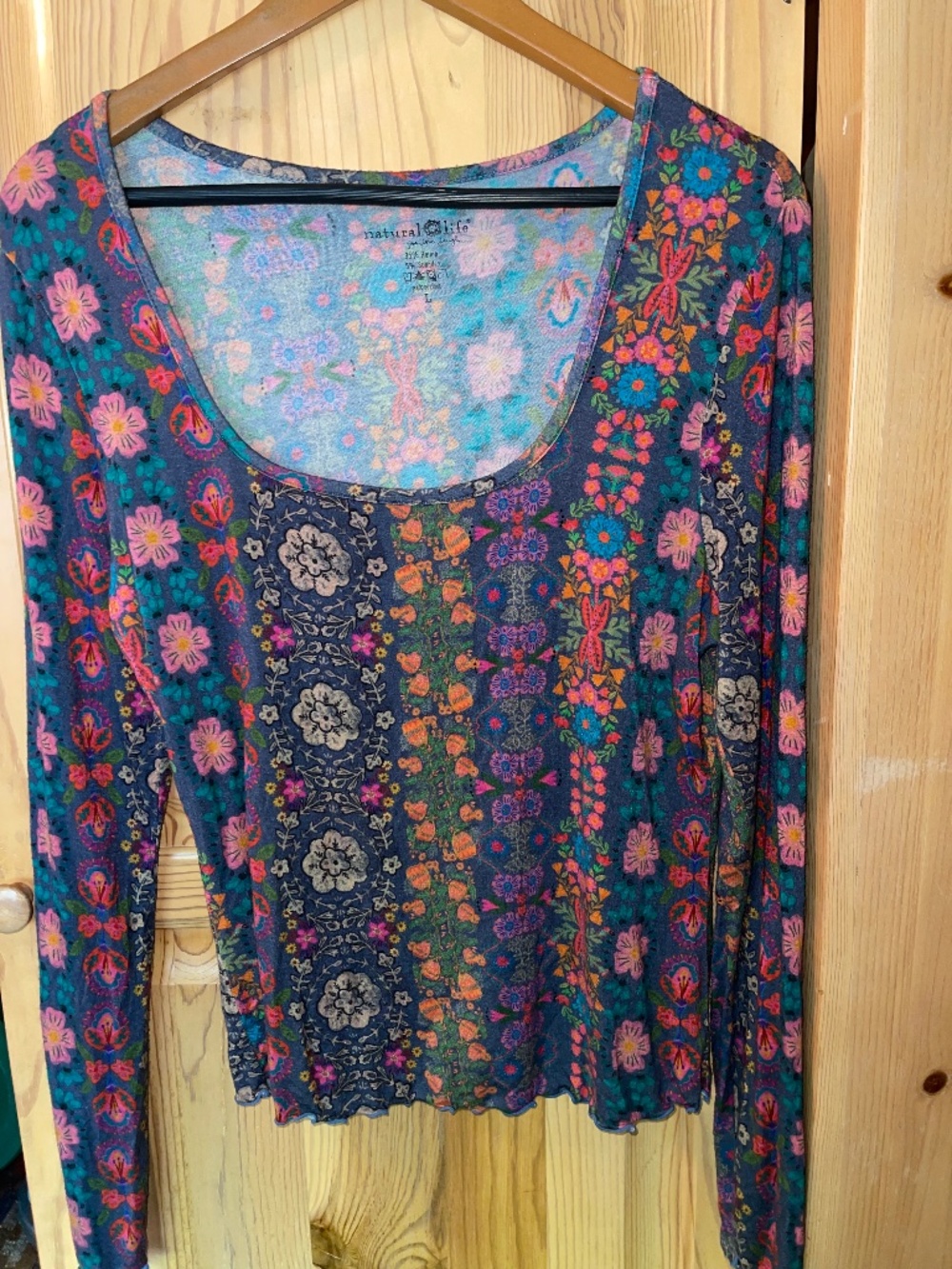 Natural Life long-sleeve top features a boho-inspired patchwork floral print